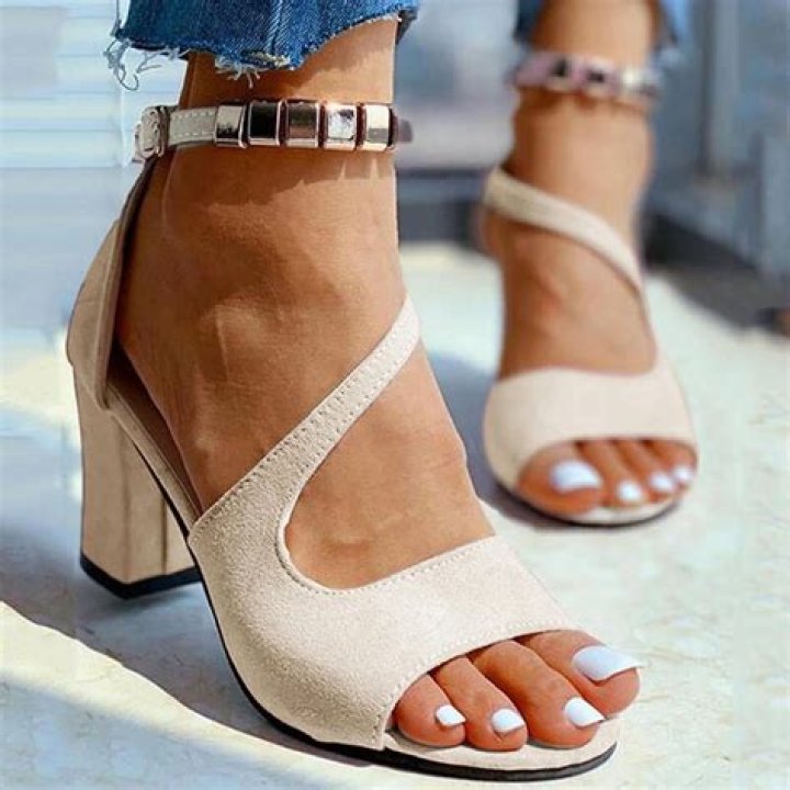 Elegant beige block heel sandals suitable for walking on sand