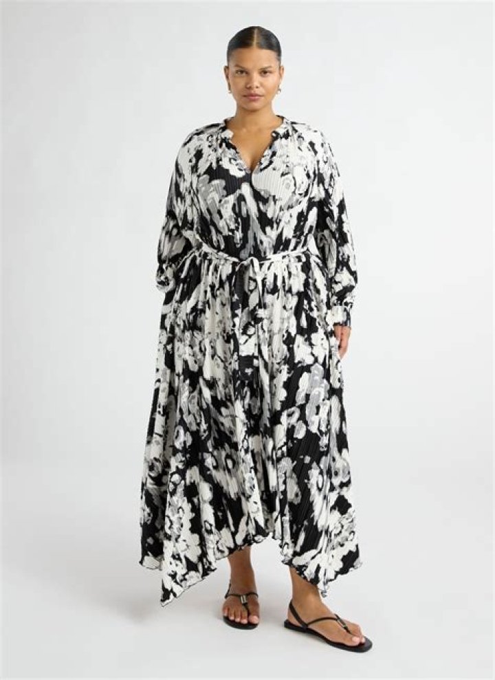 Person wearing a flowy floral midi dress at a barbecue
